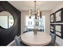 Modern dining area with round table and balcony view at 392 Pratt Se Dr # 2033, Atlanta, GA 30315