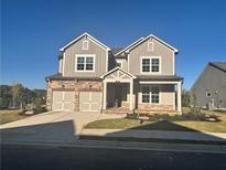Two-story house with three-car garage and front yard at 328 Willow Cv, Canton, GA 30114