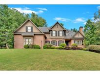 Brick two-story house with a large front yard at 1175 Bowerie Chase, Powder Springs, GA 30127
