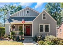 Gray house with red door and landscaped yard at 1688 Richland Sw Rd, Atlanta, GA 30311