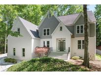 Two story house with gray roof and white siding at 4385 Wieuca Ne Rd, Atlanta, GA 30342