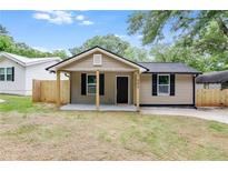 Tan house with a covered front porch at 323 Pine St, Bowdon, GA 30108