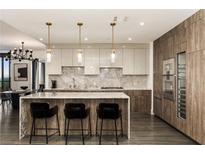 Modern kitchen with large island and stainless steel appliances at 3107 Peachtree Road Ne Unit #1803, Atlanta, GA 30305