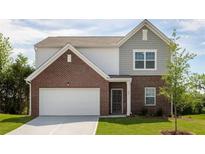 Two-story house with gray siding and brick accents at 2489 Argento Cir, Dacula, GA 30019