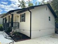 Side view of newly renovated house with modern finishes at 8165 Thompson St, Douglasville, GA 30134