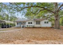 Charming ranch home with carport and mature trees at 3024 Bob Cox Rd, Marietta, GA 30064