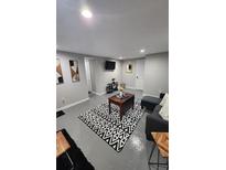 Finished basement features a living area, bedroom, and kitchenette at 818 Lee Andrews Ave, Atlanta, GA 30315