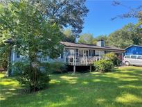 House exterior with deck and spacious yard at 427 Birch Se Ln, Conyers, GA 30094