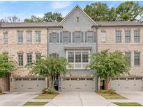 Brick townhome with 3-car garage at 2536 Skyland Ne Dr, Atlanta, GA 30319