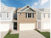 Two-story brick townhome with attached garage at 2527 Swan Lake Dr, Grayson, GA 30017