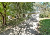 House exterior with driveway and landscaping at 3884 Wood Path Dr, Stone Mountain, GA 30083