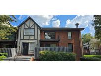 Brick building with balcony and landscaping at 6851 Roswell Rd # O9, Atlanta, GA 30328