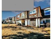 Exterior view of townhouses with landscaping at 172 Rue Fontaine, Lithonia, GA 30038