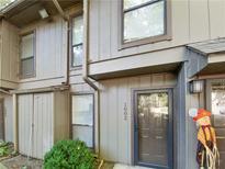 Exterior view of a townhome with landscaping at 1002 Cumberland Se Ct, Smyrna, GA 30080