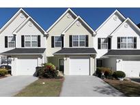 Three-unit townhouse building with attached garages and landscaping at 253 Gallant Se # 17, Mableton, GA 30126