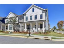 Two-story white house with a front porch at 4627 Molder Dr, Buford, GA 30518