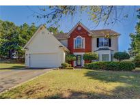 Two story house with brick and siding exterior at 2404 Lake Cove Ct, Lithonia, GA 30058