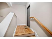 Clean and modern stairwell with light wood flooring at 238 Walker Sw St # 35, Atlanta, GA 30313