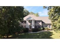 Brick home with columns and landscaping at 5335 Saville Nw Dr, Acworth, GA 30101
