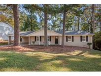 Ranch house with a covered porch and large yard at 2112 Royal Fox Way, Decatur, GA 30032