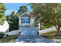 Two-story home with a two-car garage and nice landscaping at 124 Silver Fox Trl, Dallas, GA 30157
