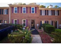 Brick townhouse with purple shutters and landscaping at 244 Timber Creek Sw Ln, Marietta, GA 30060