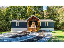 Newly renovated home with landscaped yard at 140 Walker Woods Dr, Carrollton, GA 30116