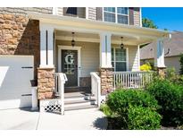 Inviting front porch with stone pillars and a charming entryway at 201 Silverwood Dr, Dallas, GA 30157