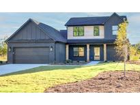 Stunning two-story home with modern exterior finishes at 3567 New Hope Rd, Dacula, GA 30019