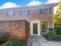 Brick townhouse with a dark brown door at 3541 Old Chamblee Tucker Rd # G, Atlanta, GA 30340