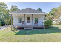 Charming one-story home with front porch at 4872 White St, Sugar Hill, GA 30518