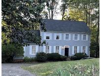 Two-story house with gray siding and white shutters at 220 Spalding Lake Pl, Atlanta, GA 30350