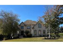 Brick two-story house with landscaped yard and large windows at 3939 Perry Pass, Lithonia, GA 30038