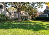 Charming house with a spacious front yard and large oak tree at 244 Rope Mill Rd, Woodstock, GA 30188
