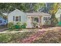 Charming light green house with brick walkway at 1618 Belmont Sw Ave, Atlanta, GA 30310