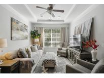 Bright and airy living room with a comfortable seating area and large windows at 10 Perimeter Summit Ne Blvd # 4435, Brookhaven, GA 30319