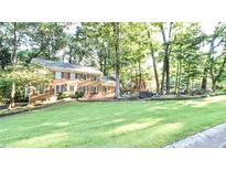 Brick home with landscaped yard and stone accents at 801 Hampton Sw Pl, Marietta, GA 30064