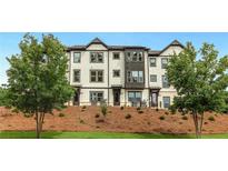 Modern townhomes with landscaped grounds and ample parking at 1086 Battery Park Rd, Decatur, GA 30033