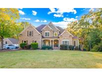 Large two-story house with brick and siding exterior at 145 Oak Forest Dr, Oxford, GA 30054