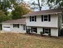 Two-story house with newly painted exterior and landscaping at 3666 Elkridge Dr, Decatur, GA 30032