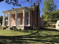 Brick home with a classic, columned facade at 3021 Stone Mountain St, Lithonia, GA 30058