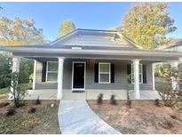 Gray craftsman style house with front porch and landscaping at 278 Privette Sw Rd, Marietta, GA 30008