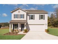 Two-story home with gray siding, gray shutters, and a two-car garage at 3270 Forest Green Dr, Douglasville, GA 30135