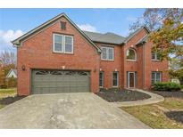 Brick house with a two-car garage and landscaped yard at 2342 Timberwolf Ct, Buford, GA 30519