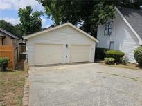Two-car garage with driveway and landscaping at 2961 Hawk Se Ct, Marietta, GA 30067
