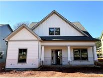 Craftsman style home with white siding, gray trim, and a covered porch at 40 Puckett Se Rd, Emerson, GA 30137