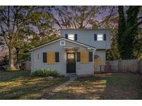 Two-story house with gray siding, updated windows, and a small front yard at 1870 S Columbia Pl, Decatur, GA 30032