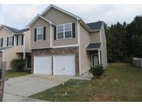 Two-story townhouse with double garage at 6511 Grey Fox Way, Riverdale, GA 30296