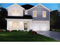 Two-story home with gray and white siding, landscaped lawn, and a two-car garage at 3277 Train St, Buford, GA 30519