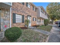 Brick front of townhome with landscaping and a walkway at 4701 Flat Shoals Rd # 54C, Union City, GA 30291